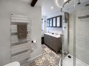 a bathroom with a shower and a toilet and a sink at Eagles Nest in Guildford