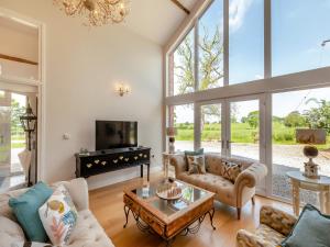 a living room with a couch and a table at Whitehill Barn - Uk47195 in Kirkcambeck