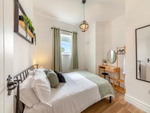 a bedroom with a bed and a desk at Bolton Farm in Durham