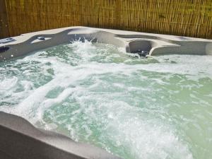 a jacuzzi tub with water in it at The Hayloft - Ukc1038 in Hickling