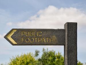 a street sign that reads public footpath at Marshall Cottage in Santon