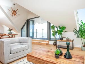 a living room with a couch and a table at The Penthouse in Woolacombe