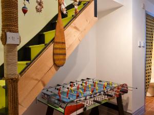 a table with legos on it next to a staircase at Fronks House in Harwich