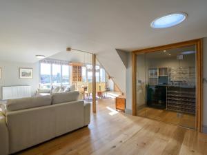 a living room with a couch and a table at Penthwaite in Leyburn +23 photos