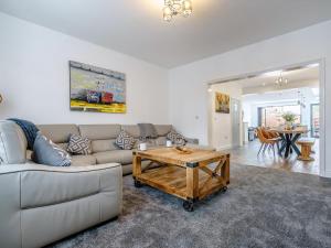 a living room with a couch and a coffee table at Wynbec Cottage in Esh