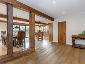 a living room with a table and a dining room at Olive Lodge in Melbourne