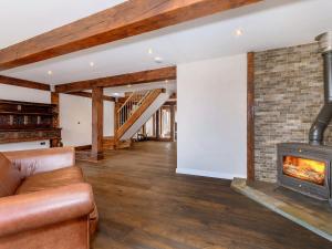 a living room with a couch and a fireplace at Olive Lodge in Melbourne