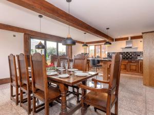 a kitchen and dining room with a wooden table and chairs at Olive Lodge in Melbourne +24 photos
