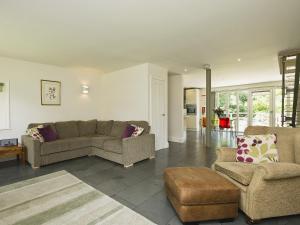 a living room with a couch and two chairs at Curlew Barn in Sutton Bridge +9 photos
