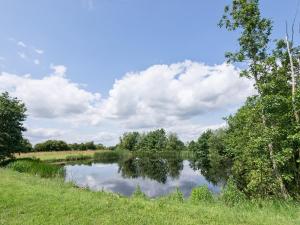 a river with trees and clouds in the sky at Eastlands Barn in East Barkwith +19 photos