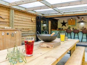 a wooden table with a bowl on top of it at Old Shires Barn in Norton