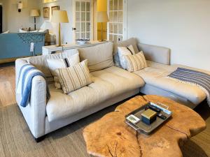 a living room with a couch and a coffee table at Cairn Ryan in Saint Mawes