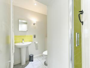 a bathroom with a sink and a toilet at The Row in Much Marcle