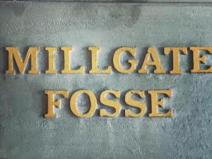 a metal sign that reads mille gate tossurance at Millgate Fosse Cottage in Richmond