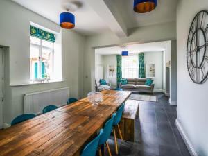 a dining room with a wooden table and chairs at Salt House - Uk43012 in Berkeley