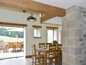 a dining room with a table and chairs at Deer Park - Uk33360 in Reeth +33 photos