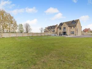 a large yard in front of a large house at The Old School House in Barnsley +28 photos