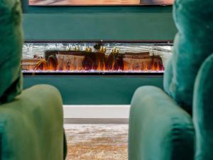 a living room with a fire in a fireplace at Fairview in Penicuik