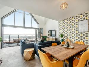a dining room with a table and chairs at Sandbanks in Bridlington