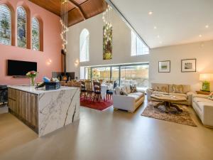 a living room filled with furniture and a fireplace at Auld Kirk House in Duns