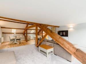 a living room with a couch and a table at Cragdale Penthouse in Settle +19 photos