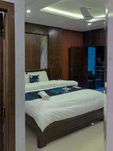 a bedroom with a large bed in a room at Go Glam Hotels Murree in Murree