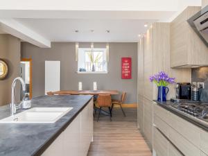 a kitchen with a sink and a counter top at Formans Lodge in Musselburgh