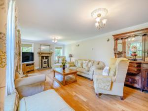 a living room with a couch and a tv at The Farmhouse- Uk47148 in Burgh le Marsh