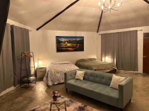 a living room with a couch and a bed at MERs house enjoys nature in Cajamarca