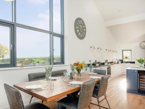 a dining room with a table and chairs at Foxglove-Uk34612 in Nether Stowey +24 photos