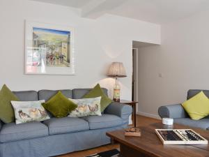 a living room with a couch and a table at Brittain House in Richmond