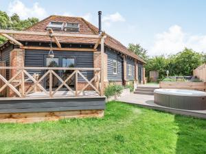 a home with a deck and a house at Silhouette's Stable - Uk34102 in Chichester