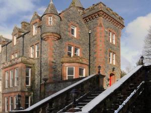 an old castle with snow on the stairs at West Lodge - Uk7137 in Newton Stewart