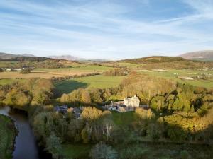 an aerial view of a house next to a river at West Lodge - Uk7137 in Newton Stewart +10 photos