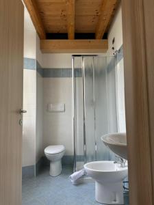a bathroom with a toilet and a sink at Locanda Graziella in Moerna
