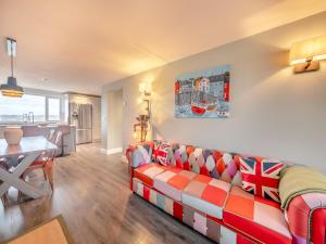a living room with a couch and a table at Wynmine Cottage in Esh