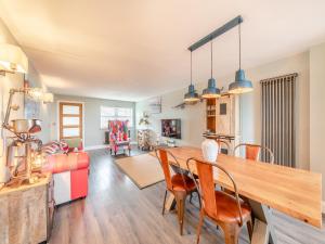 a dining room and living room with a table and chairs at Wynmine Cottage in Esh +13 photos