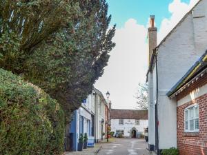 an empty street in a small town with buildings at Old Barn 1 - Uk48477 in Ferndown