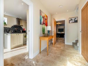 a kitchen and living room with a table and a counter at Old Barn 1 - Uk48477 in Ferndown