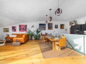 a living room and dining room with a dining table at Cyan in Mortehoe