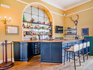 a bar with a blue island in a room at Pengethley Manor - Uk39045 in Peterstow