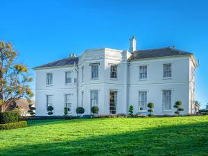 a large white house on a grassy field at Pengethley Manor - Uk39045 in Peterstow +24 photos