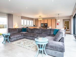 a living room with a couch and a table at The Pines - Ukc4615 in Dunholme