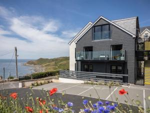 a house with a view of the ocean at Seaglass in Mortehoe