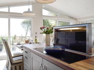 a kitchen with a table with a bowl on a counter at Seacliff in Corton