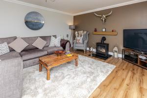 a living room with a couch and a coffee table at Seaview Bed & Breakfast in Isle of Lewis