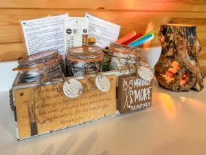 a box filled with jars of food on top of a counter at Lakeview Lodge- Uk40692 in Crowhurst