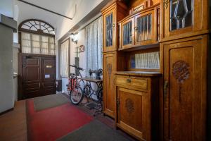 a home hallway with wooden cabinets and a red rug at G40 Boutique Hotel in Odesa