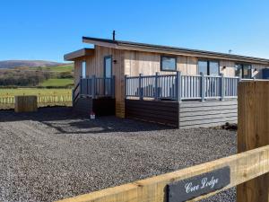 a house with a fence in front of it at Cree Lodge - Uk13636 in Creetown
