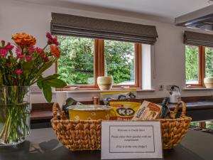 a basket of food on a counter in a kitchen at Dodds Barn in Fersfield
